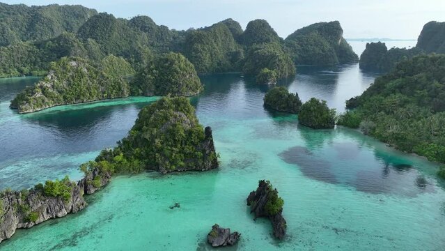Rugged limestone islands, eroded over millions of years, rise from Raja Ampat's idyllic seascape. This area of eastern Indonesia is known for its spectacular marine biodiversity.
