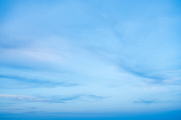 Pastel Blue and Pink Sky with light fluffy clouds