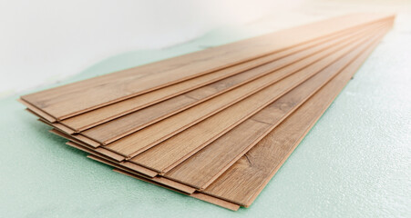 Installing laminated or wood parquet on floor, wooden tile