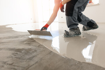 Screed concrete with self leveling cement mortar for floors. Master work renovation home