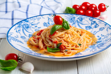 Spaghetti with Tomato and Basil Leaf.
