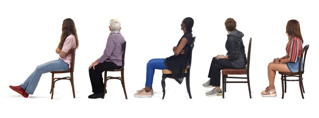 group of woman sitting on chair and looking back on white background