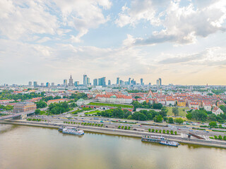 Fototapeta na wymiar Aerial panorama of Warsaw, Poland over the Vistual river and City center in a distance. Downtown skyscrapers cityscape. Business