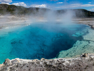 Grand  Blue Prismatic Spring with steam rising in Yellowstone