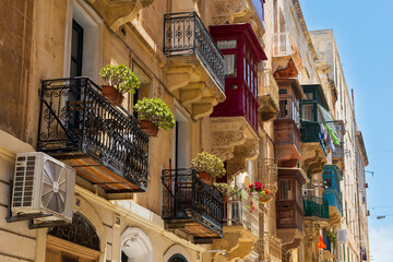 Typical view of Maltese balconies in Malta capital Valletta on a bright sunny afternoon.