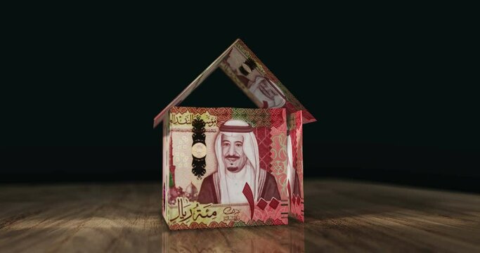 Saudi Arabia Rial 100 SAR money banknotes paper house on the table. Saudi Arabia currency notes 3D concept home mortgage loan, debt, rent, liabilities and building wealth financing.