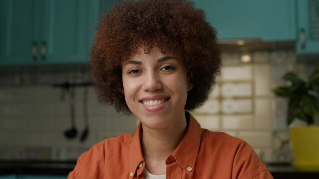 Smiling African American Woman Portrait. Confident black female looking at camera.