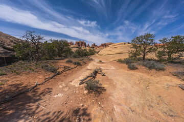 hiking the chesler park loop trail in the needles in canyonlands national park, usa