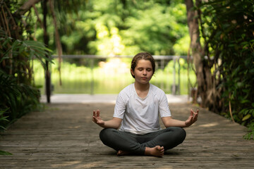 Fototapeta premium Woman Yoga - relax in nature. beauty woman doing yoga at park. woman practising yoga at park..