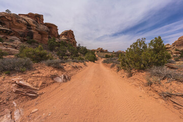 hiking the chesler park loop trail in the needles in canyonlands national park, usa
