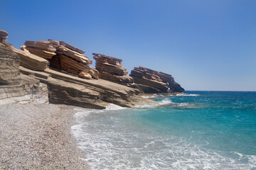 Triopetra, cliffs of platy sandstone on Crete in a turquoise sea