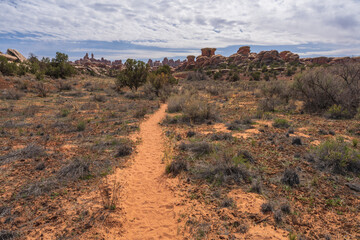 hiking the chesler park loop trail in the needles in canyonlands national park, usa