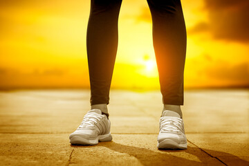young woman runner running on city bridge road