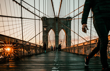 runner feet at Brooklyn Bridge New York   at sunrise