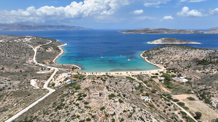Aerial drone scenic photo of beautiful sandy beach of Livadi featuring ruins of Venetian castle...
