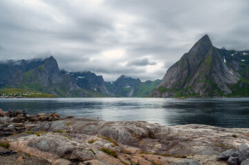 Fototapeta na wymiar Mountainous coast with sea and rocky beach - Lofoten, Norway