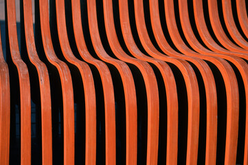 Brown wooden slats. A beautiful piece of outdoor decoration. Abstract background.