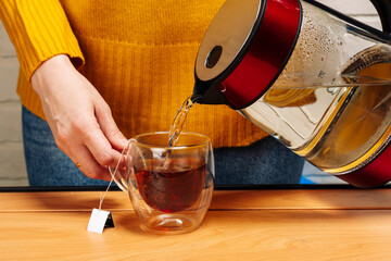 women's caring hands brew delicious fragrant tea