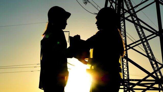 silhouette electrician engineer laptop, group people deal, business teamwork, digital computer, energy tablet, electrical substation, experienced engineer, electrical engineer reading tablet sunset
