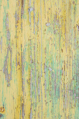 textura de madera vieja pintada de colores verdes y amarillo rasgada