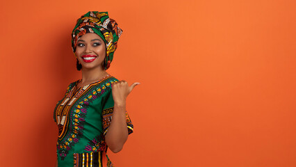 Positive young black woman pointing at copy space, web-banner