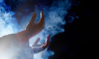 Fototapeta na wymiar Muslim man hands praying on dark background