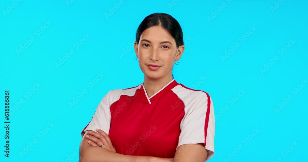 Poster Soccer, focus and arms crossed with a sports woman in studio isolated on a blue background for training. Portrait, football and fitness with a serious young female athlete ready for a game or match