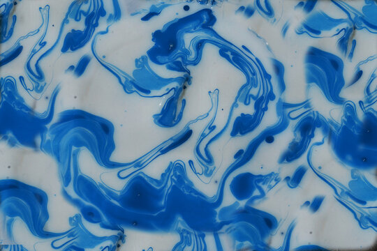 Photographs of Splash paint.Closeup abstract color mixing of water, acrylic,oil and milk for use as background image. Acrylic texture with marble or ocean pattern, multi color background photo