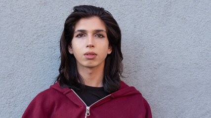 Portrait of a non-binary person posing for the camera.