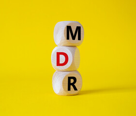 BPM - Business Process Management symbol. Wooden cubes with words BPM. Beautiful yellow background....