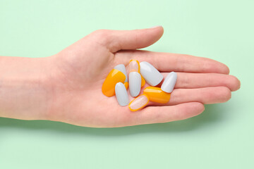 Woman with press-on nails on green background