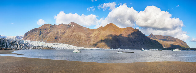 Breathtaking view of Skaftafellsjokull glacier tongue and volcanic mountains around on South...