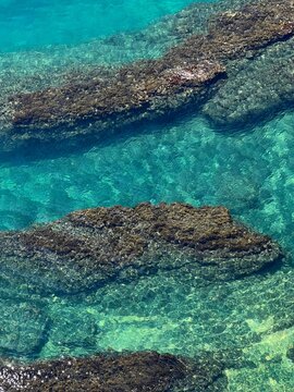 Sea water blue turquoise shiny surface reef beautiful seascape.