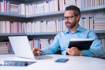 Teachers day. Teacher in school classroom. Knowledge and education with middle aged teacher. Millennial teacher with book. Man teaching lesson in class. Teachers from university exam. College teacher.