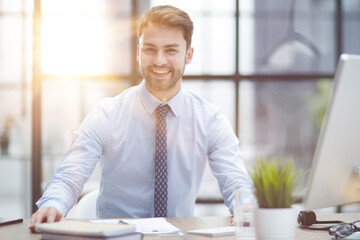 Young businessman working at office