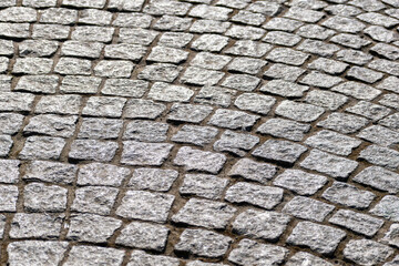 paving, old stones,Texture of fragment of gray path made of masonry with sand in seams between paving stones. 