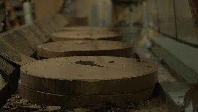 dolly close up shot of pressed cocoa discs