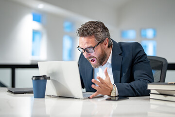 Angry Business man entrepreneur startup owner in modern office. Angry Business portrait. Angry business worker. Business, finance and employment. Angry office worker.