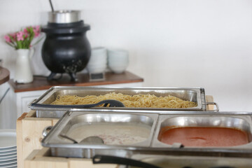 Various food served on a buffet line