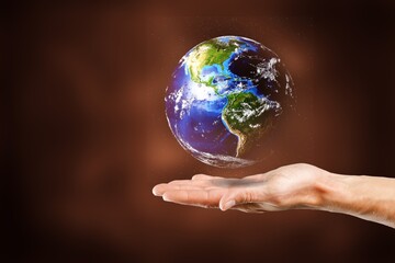 Protecting concept, hand holds a globe