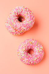 Sweet donuts on pink background
