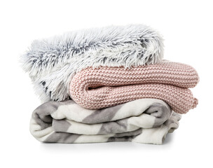 Fototapeta na wymiar Different soft folded blankets on white background