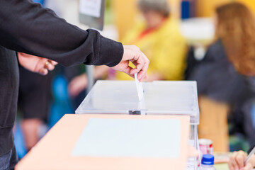 voting candidate campaign in democracy ballot box. Latin mid hand unrecognizable man  - obrazy, fototapety, plakaty