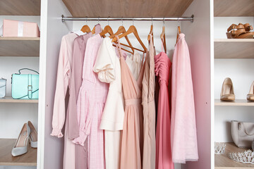 Beautiful prom dresses hanging in boutique © Pixel-Shot