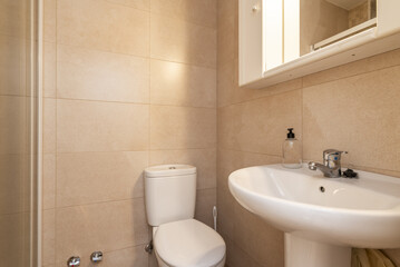 Small and simple bathroom with a white porcelain sink