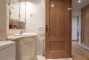 Small bathroom with a white porcelain sink embedded in a marble