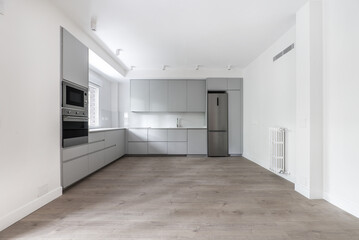 Newly installed modern kitchen covering two L-shaped