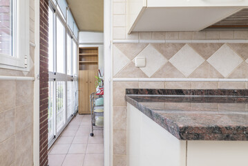 Corner of a kitchen kitchen with polished granite worktop