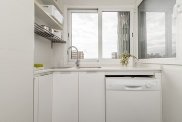 Small kitchen cubicle with dishwasher, double sink
