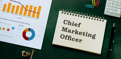 There is notebook with the word Chief Marketing Officer. It is as an eye-catching image.